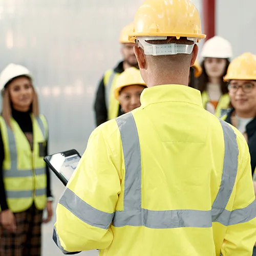 Workers attending a safety meeting